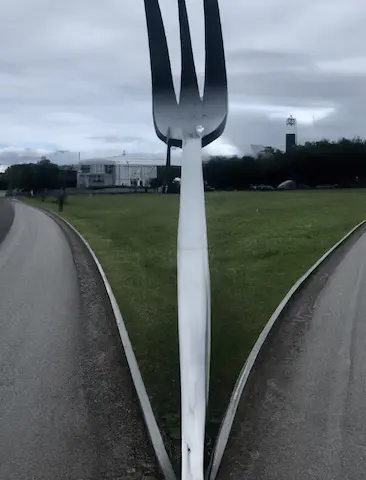 A left road and a right road separated by
       a giant stainless steel fork -- Made in Dall-E